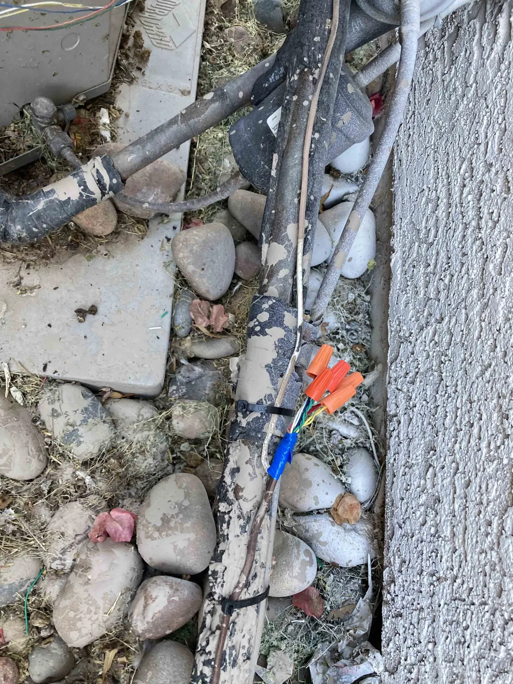 Exposed outdoor wiring found during an AC service call